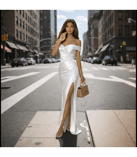 Дълга бяла рокля до земята с цепка паднало рамо и цепка до долу бал 2025